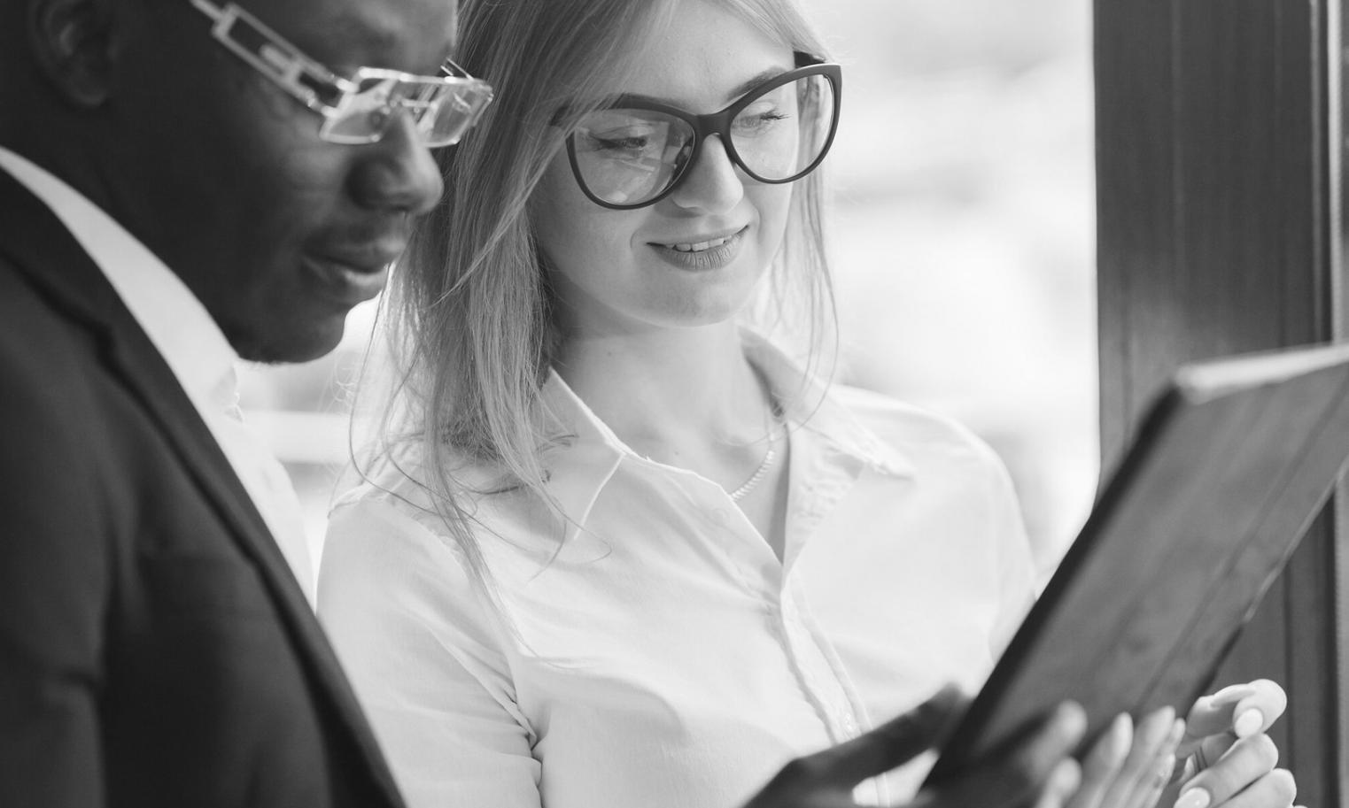 Financial analyst reviewing scenario modeling results on computer screen